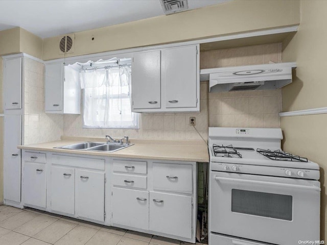 kitchen featuring white cabinetry, sink, white range with gas stovetop, backsplash, and extractor fan