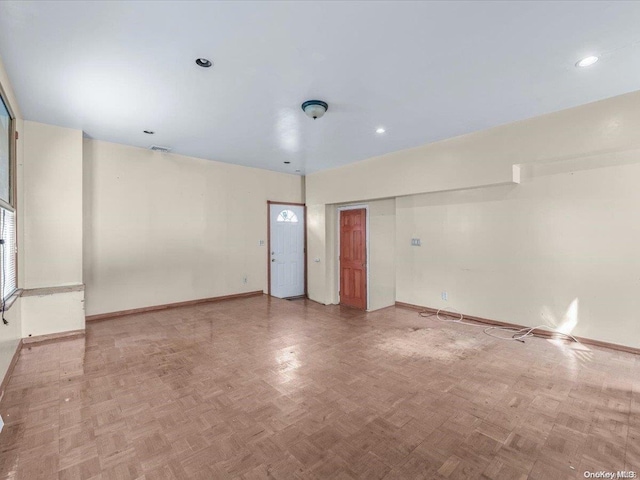 empty room featuring parquet flooring