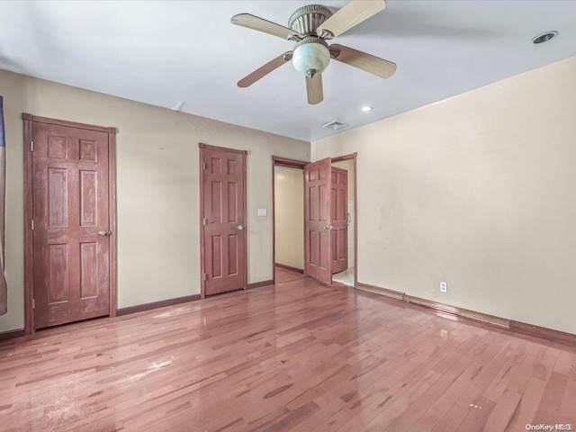 unfurnished bedroom featuring ceiling fan and light wood-type flooring