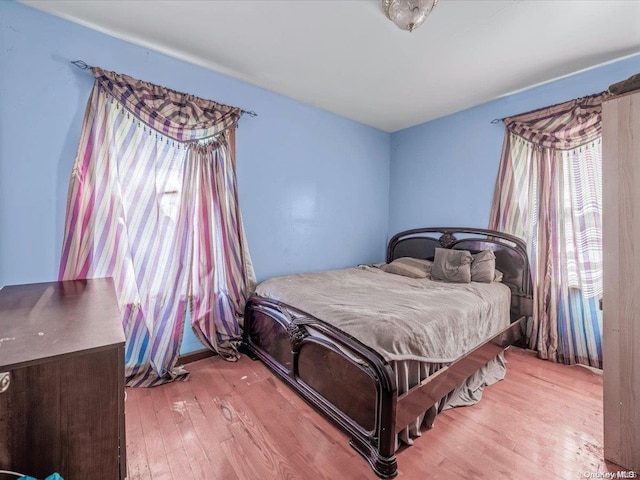 bedroom with light hardwood / wood-style flooring