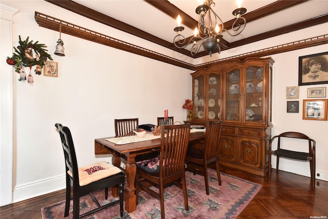 dining area featuring dark parquet flooring, crown molding, and a chandelier