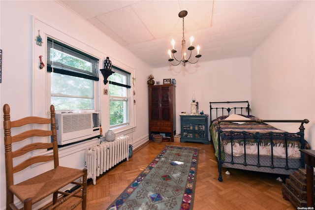 bedroom with radiator heating unit, an inviting chandelier, light parquet floors, and cooling unit