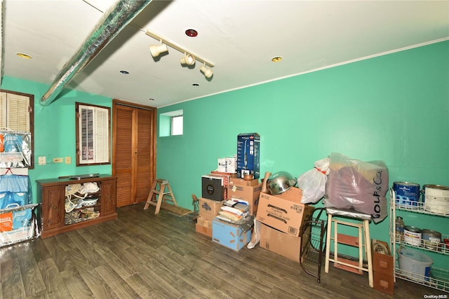 miscellaneous room with beamed ceiling and dark hardwood / wood-style floors