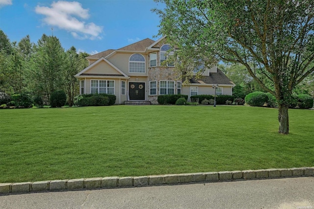 view of front of property with a front lawn