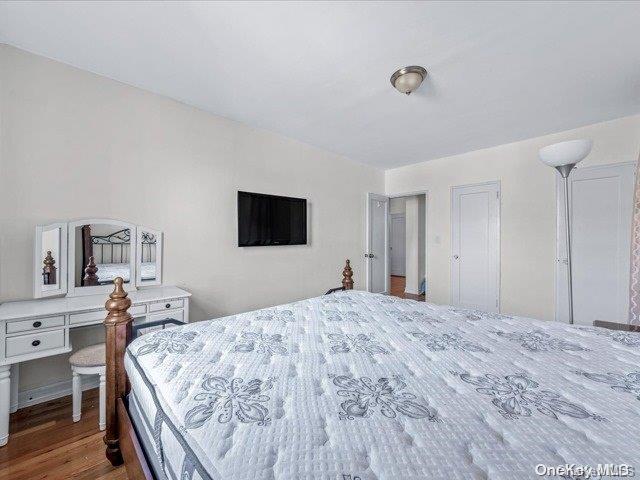 bedroom with wood-type flooring