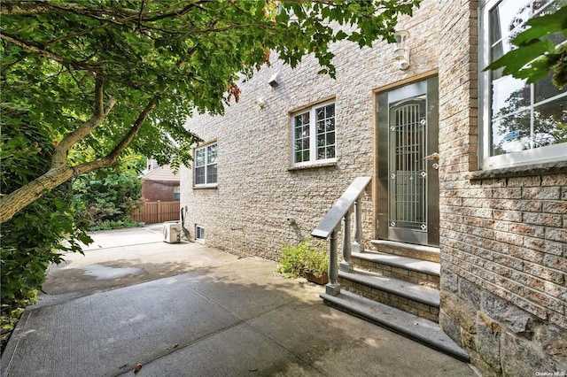 property entrance featuring a patio