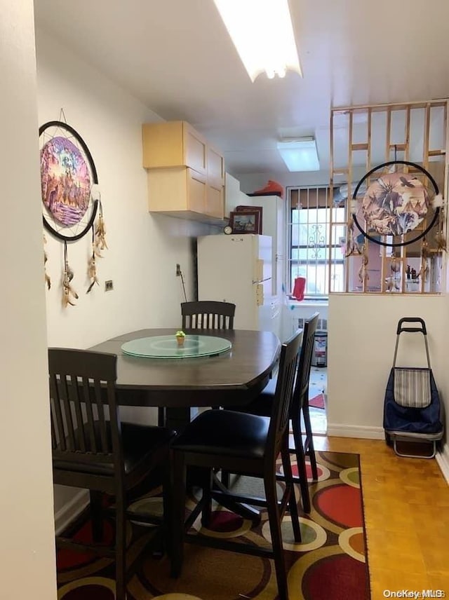 dining room featuring light hardwood / wood-style flooring