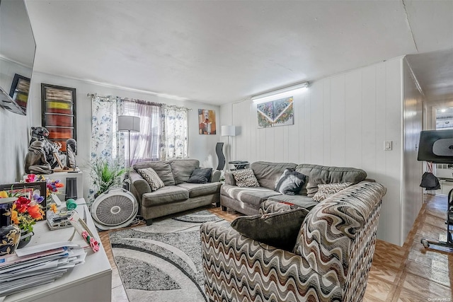 living room featuring wooden walls