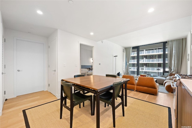 dining room with light hardwood / wood-style flooring