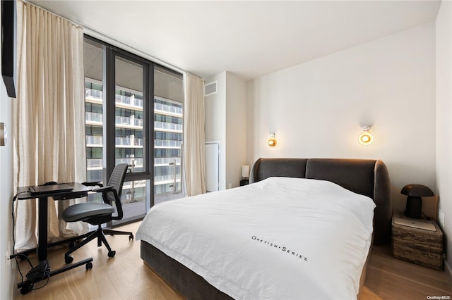 bedroom with wood-type flooring