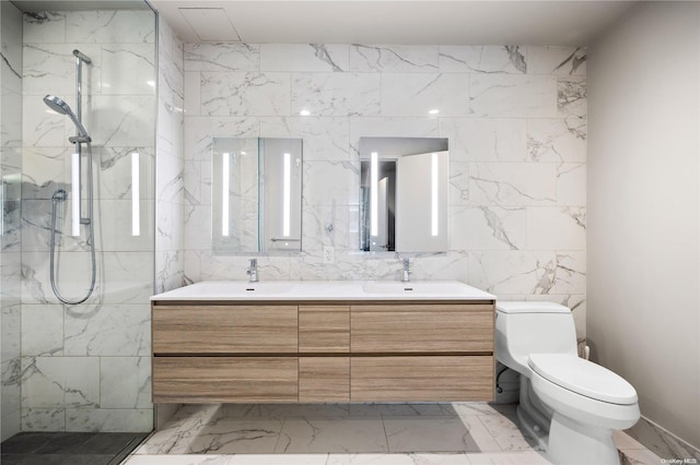 bathroom featuring a tile shower, vanity, and toilet