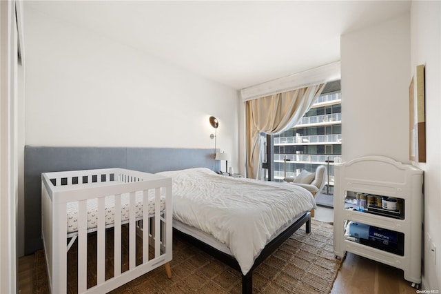 bedroom featuring dark hardwood / wood-style flooring