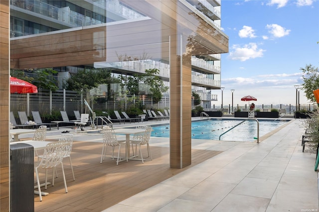 view of pool featuring a patio area