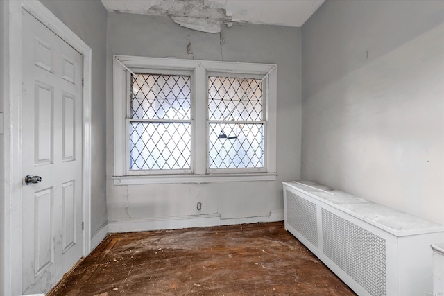 empty room featuring radiator heating unit