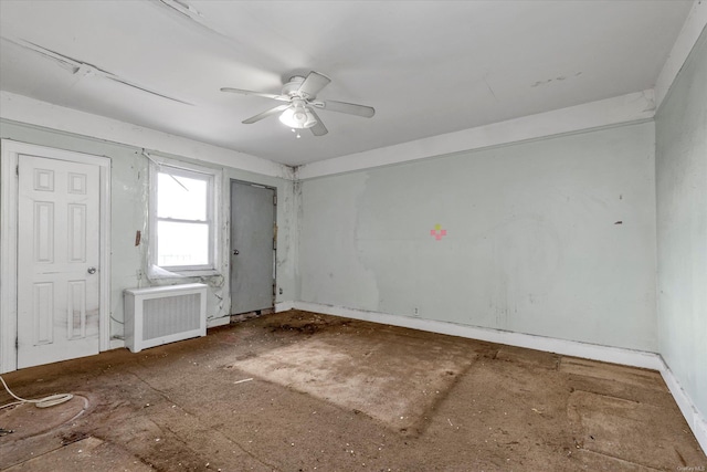 empty room with ceiling fan and radiator heating unit