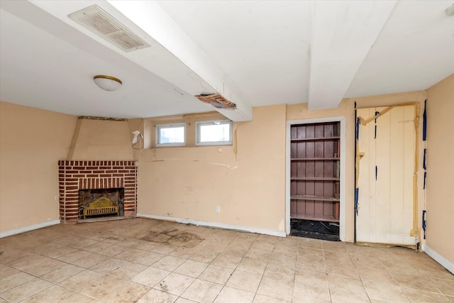 unfurnished living room with a fireplace