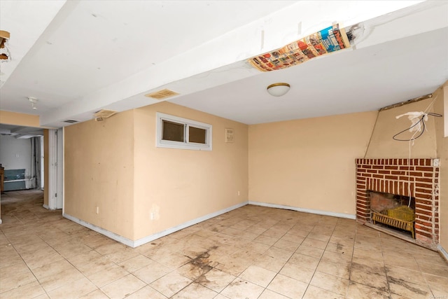 basement featuring a brick fireplace