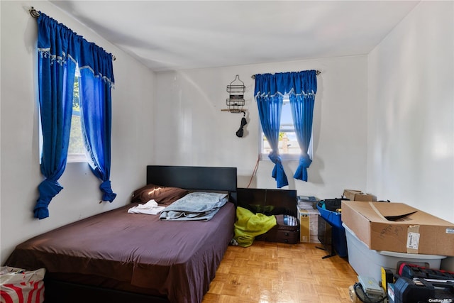 bedroom featuring parquet floors