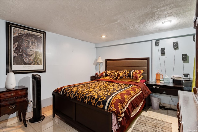 tiled bedroom with a textured ceiling