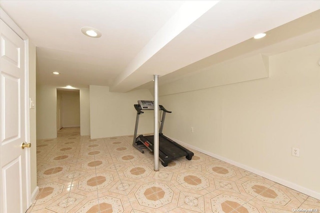 exercise room featuring light tile patterned flooring