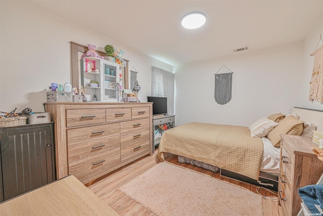 bedroom with wood-type flooring