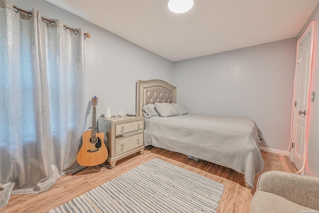 bedroom with light hardwood / wood-style floors