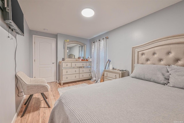 bedroom with light hardwood / wood-style flooring