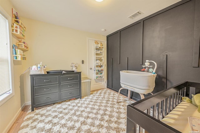 bathroom featuring plenty of natural light and wood-type flooring