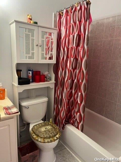 full bathroom with tile patterned flooring, shower / tub combo, vanity, and toilet