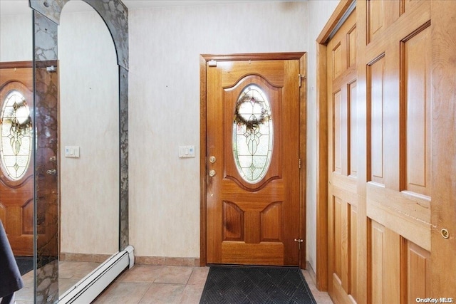 entryway with a baseboard radiator and light tile patterned flooring