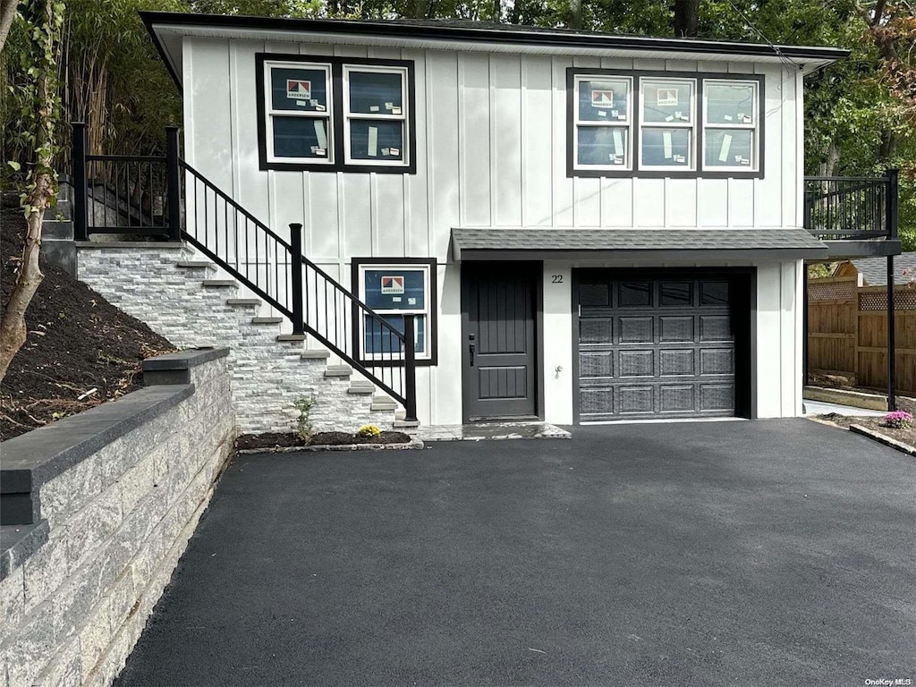 view of front of property with a garage