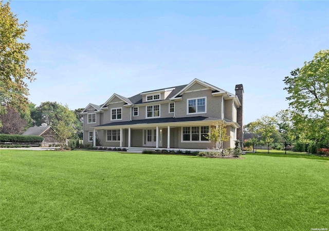 craftsman house with a porch and a front yard