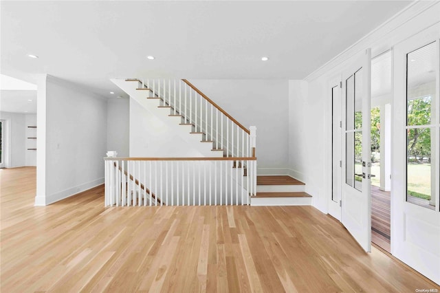 entryway with light hardwood / wood-style floors and a wealth of natural light