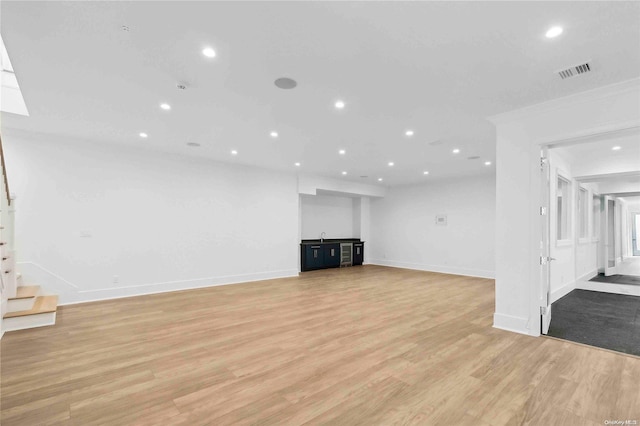 unfurnished living room with light hardwood / wood-style floors