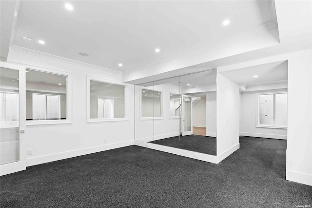 carpeted empty room with crown molding