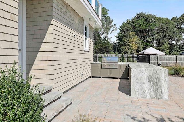 view of patio / terrace featuring area for grilling and exterior kitchen