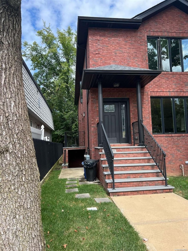 entrance to property with a yard