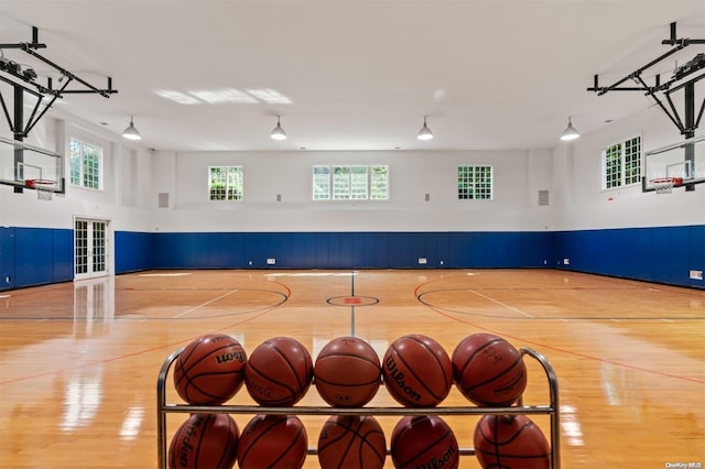 view of basketball court featuring a wealth of natural light