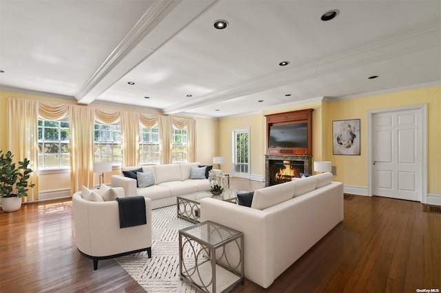 living room with ornamental molding and hardwood / wood-style flooring