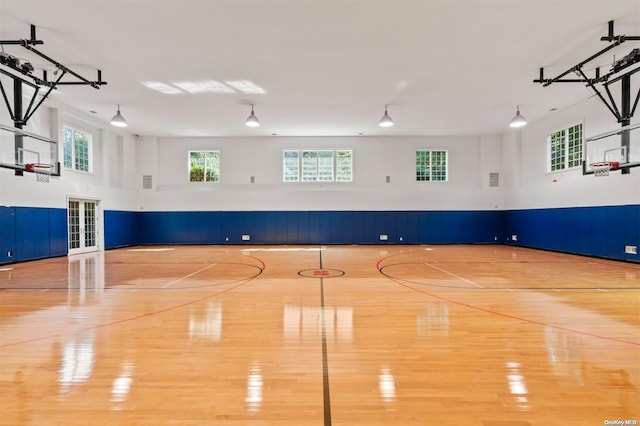 view of sport court featuring a healthy amount of sunlight