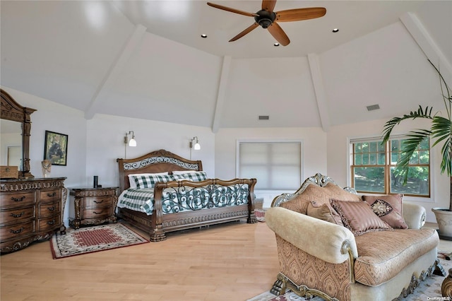 bedroom featuring ceiling fan, high vaulted ceiling, and light hardwood / wood-style flooring