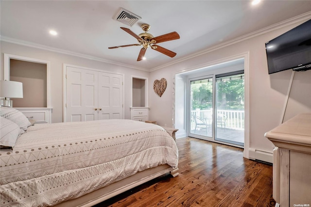 bedroom featuring ceiling fan, dark wood-type flooring, a baseboard heating unit, crown molding, and access to outside