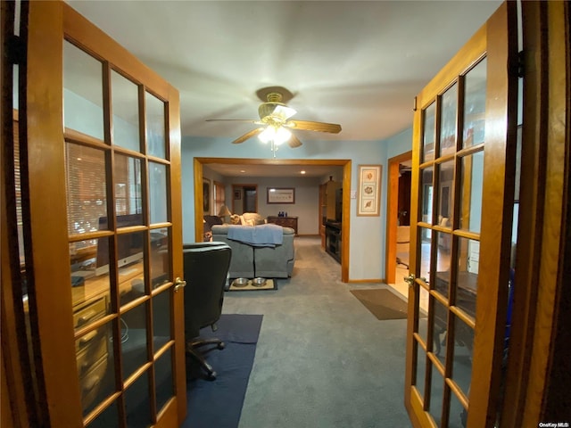 office area featuring carpet flooring, french doors, and ceiling fan