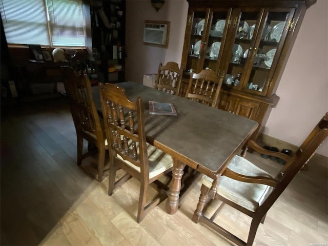 dining space with light hardwood / wood-style flooring