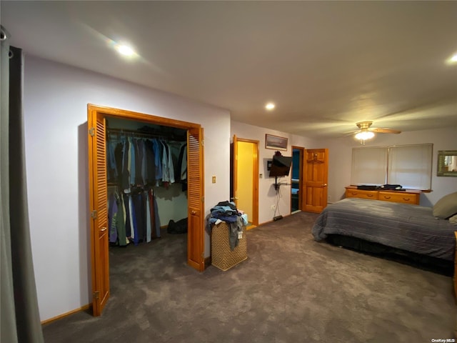 carpeted bedroom with ceiling fan and a closet