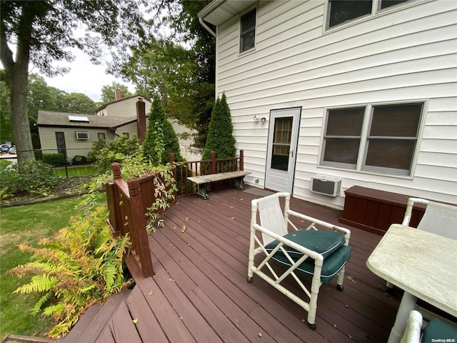 wooden deck with an AC wall unit