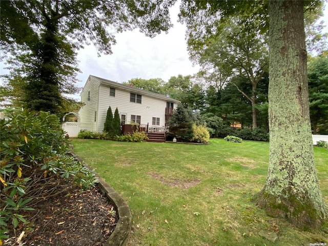 view of yard with a wooden deck