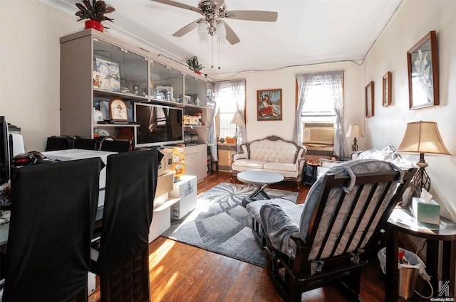 office featuring hardwood / wood-style flooring, ceiling fan, and crown molding