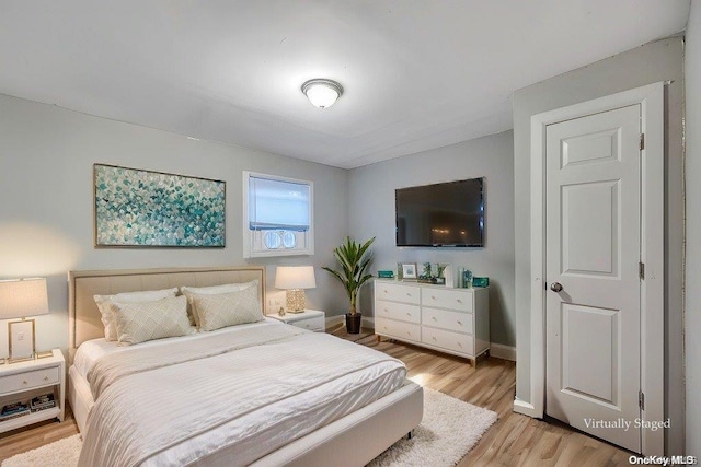 bedroom with light hardwood / wood-style floors