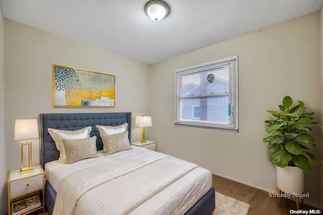 bedroom featuring hardwood / wood-style flooring